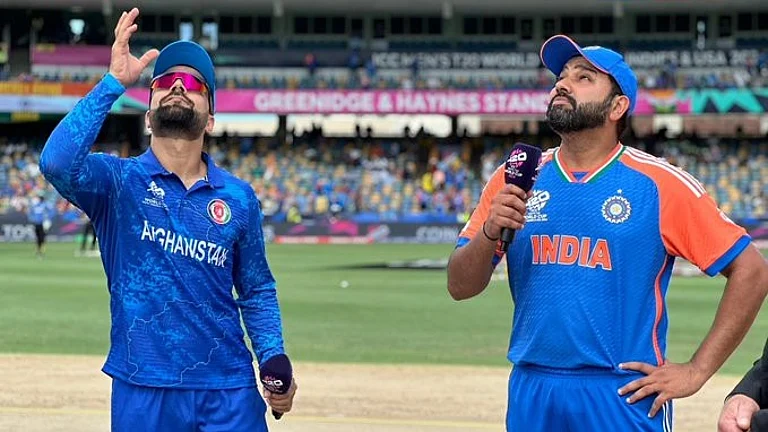 India skipper Rohit Sharma (R) with Afghanistan skipper Rashid Khan at toss of their Super 8 match at the T20 World Cup 2024 on Thursday. - X/@ACBofficials