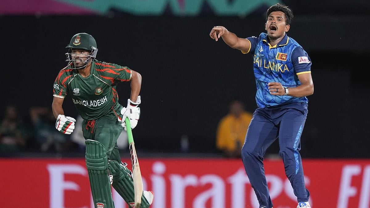AP : Sri Lanka's Maheesh Theekshana, right, reacts as Bangladesh's Najmul Hossain Shanto sets off for a run during their ICC T20 World Cup 2024 match at Grand Prairie Stadium, Texas, USA on June 7, 2024.