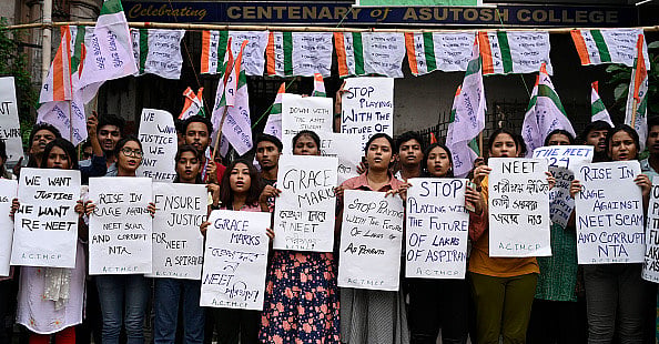  (Photo by Samir Jana via Getty Images) : Trinamool Chhatra Parishad (TMCP), students wing of All India Trinamool Congress (TMC) supporters staged a protest against recent scam in NEET and UGC-NET exam in front of Asutosh College, on June 22, 2024 in Kolkata, India.