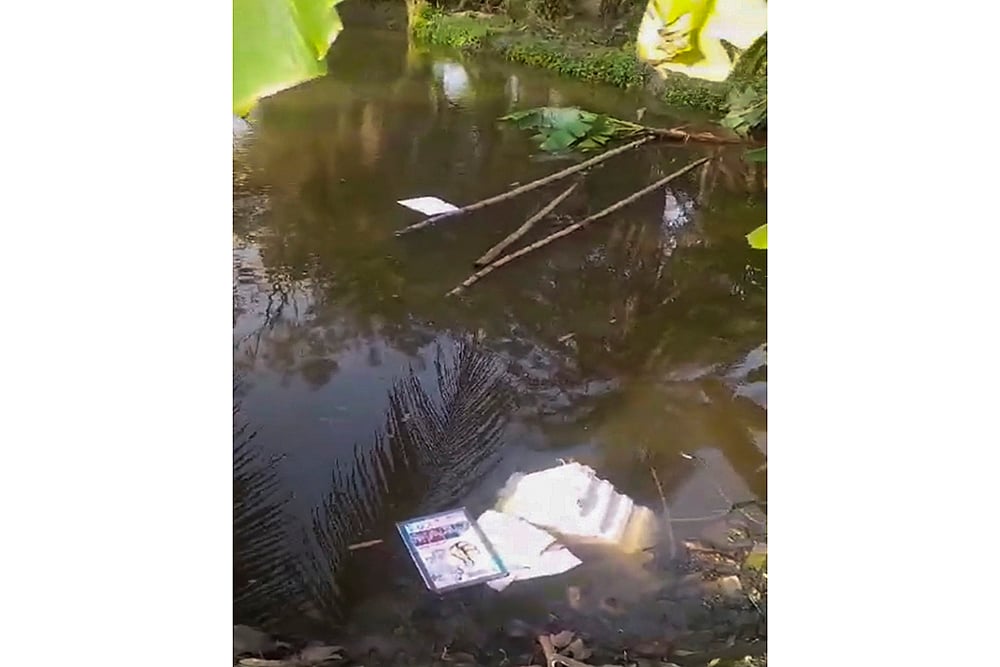 Election material thrown in a pond in South 24 Parganas 