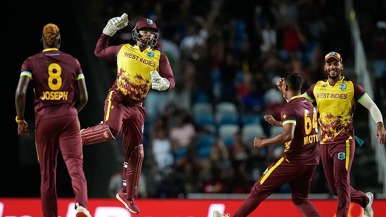 West Indies' Nicholas Pooran, second left, celebrates after taking a catch to dismiss New Zealand's captain Kane Williamson during their T20 World Cup 2024 match in Trinidad on Wednesday (June 13). - AP/Ramon Espinosa