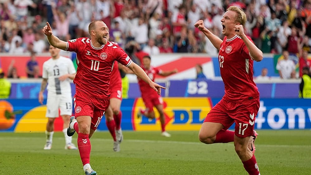 | Photo: AP/Matthias Schrader : Denmark players celebrate a goal at Euro 2024.