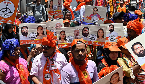 Supporters of NCP, Shiv Sena and BJP during the rally of Yamini Jadhav, Shiv Sena candidate for South Mumbai. - Getty Images