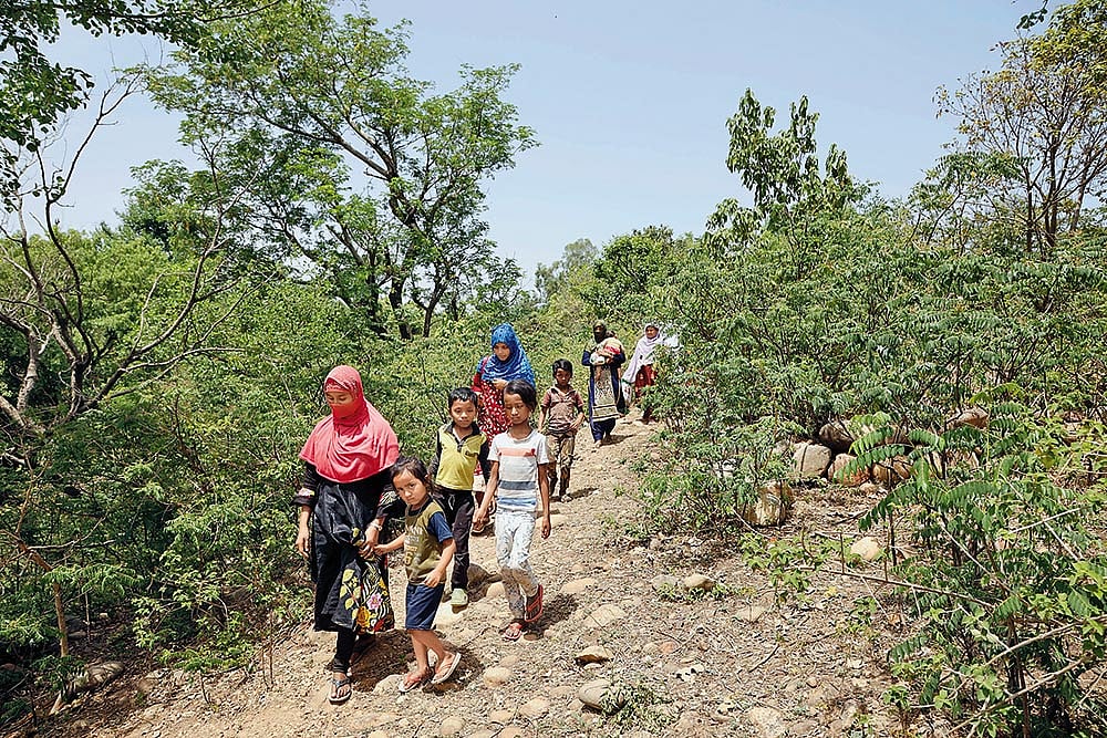Photo: Umar Farooq : Life as a Refugee: Rohingya women and children seeking shelter after a raid in the Jammu camps