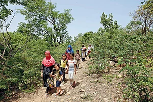 Photo: Umar Farooq : Life as a Refugee: Rohingya women and children seeking shelter after a raid in the Jammu camps