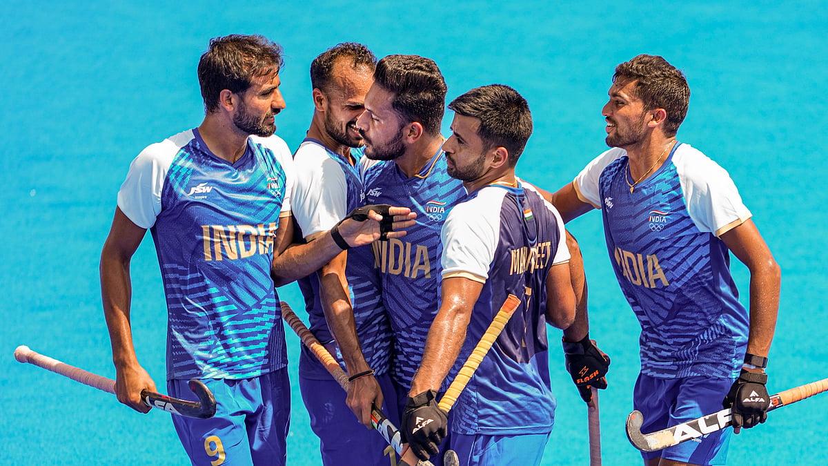 Harmanpreet Singh celebrates with teammates. PTI Photo