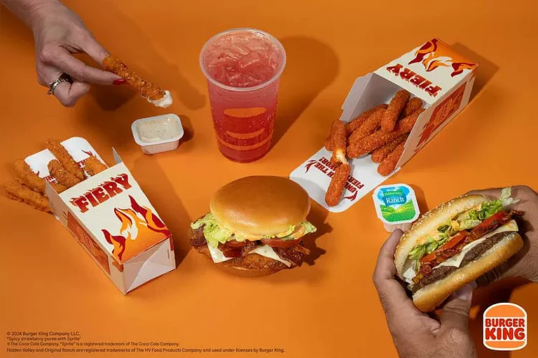 The menu includes varying spice levels, from the mild "Fiery Strawberry & Sprite" to the extra-hot "Fiery Bacon Royal Crispy Chicken Sandwich." - null