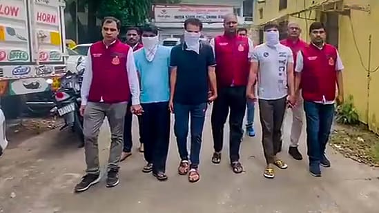 Delhi Police with the ones accused of running organ transplant racket on Tuesday. - PTI