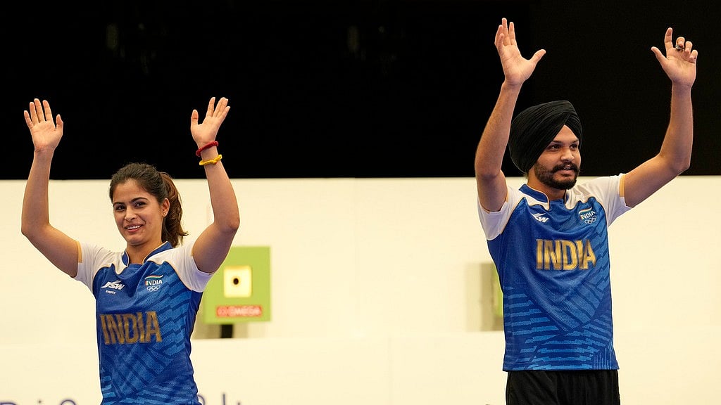AP/Manish Swarup : India's Manu Bhaker, left, and Sarabjot Singh celebrate after winning the bronze medal in the 10m air pistol mixed team event at the 2024 Summer Olympics, Tuesday, July 30, 2024, in Chateauroux, France.