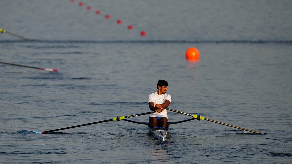 AP/Lindsey Wasson : Balraj Panwar, of India, trains ahead of competing in the men's single sculls rowing quarterfinal at the 2024 Summer Olympics, Tuesday, July 30, 2024, in Vaires-sur-Marne, France.
