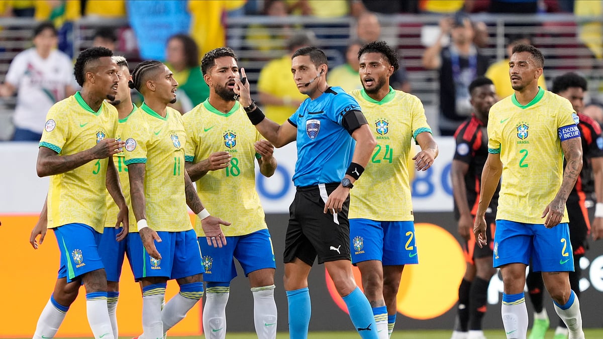 Players of Brazil remonstrate with referee Jesus Valenzuela at the end of a Copa America Group D football match against Colombia. AP Photo