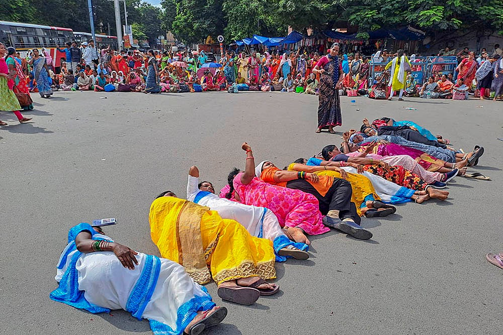 National Health Mission employees protest at Koti in Hyderabad