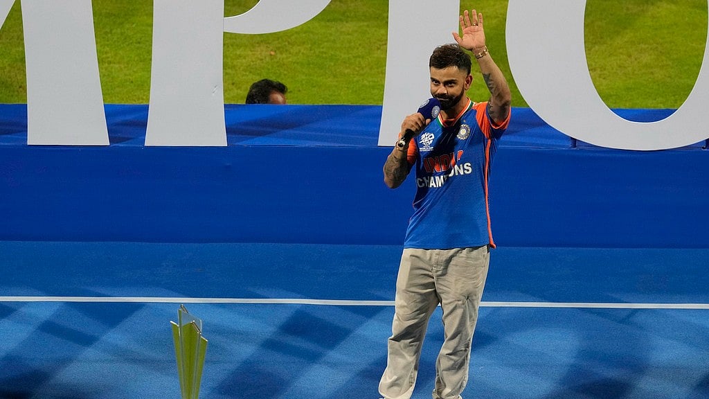Virat Kohli speaks and waves during a ceremony at Wankhede Stadium, celebrating their T20 Cricket World Cup win. - AP