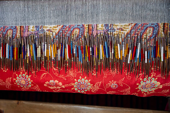 Getty Images : Wooden needles and pashmina yarn are being used to weave a traditional Kani Shawl on a loom in a shawl weaving factory on the outskirts of Srinagar. A traditional Kani Shawl in Kashmir, showcasing the exquisite craftsmanship and detailed artistry that have been revered since the Mughal Era.