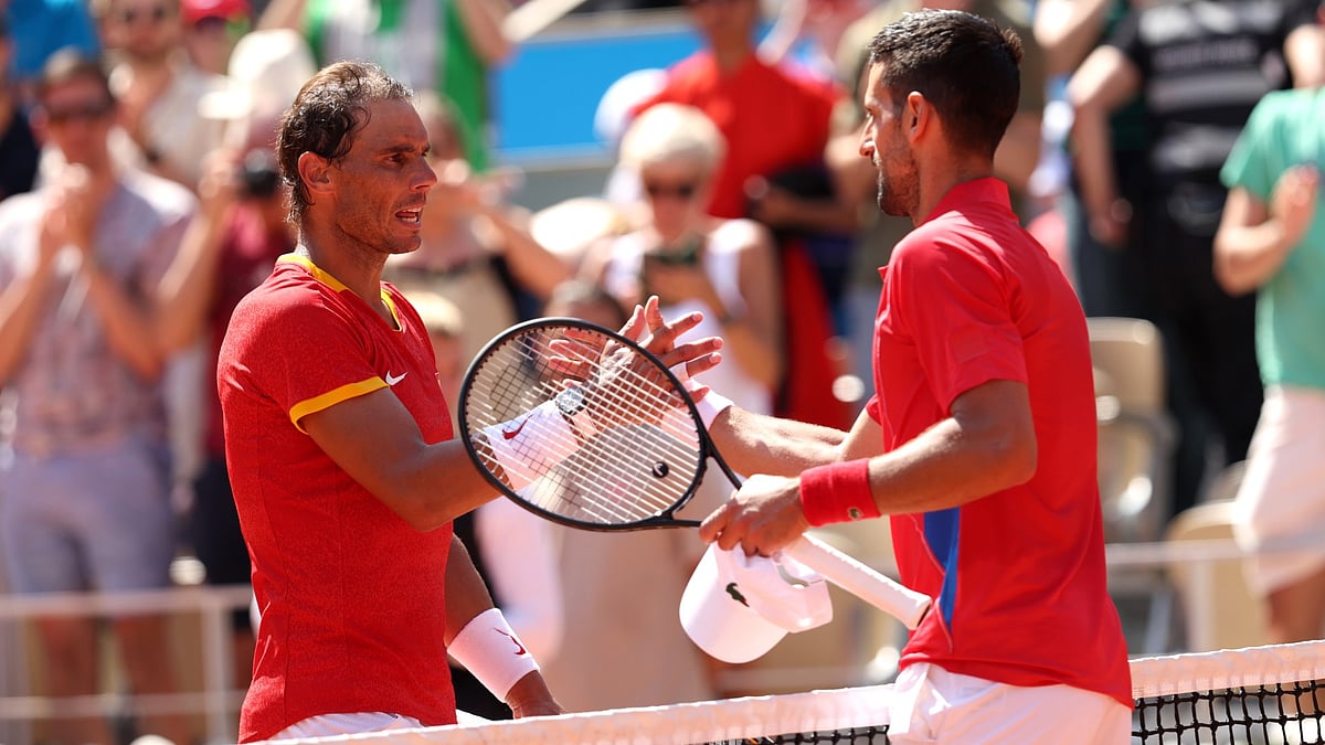 Rafael Nadal and Novak Djokovic at the net - null