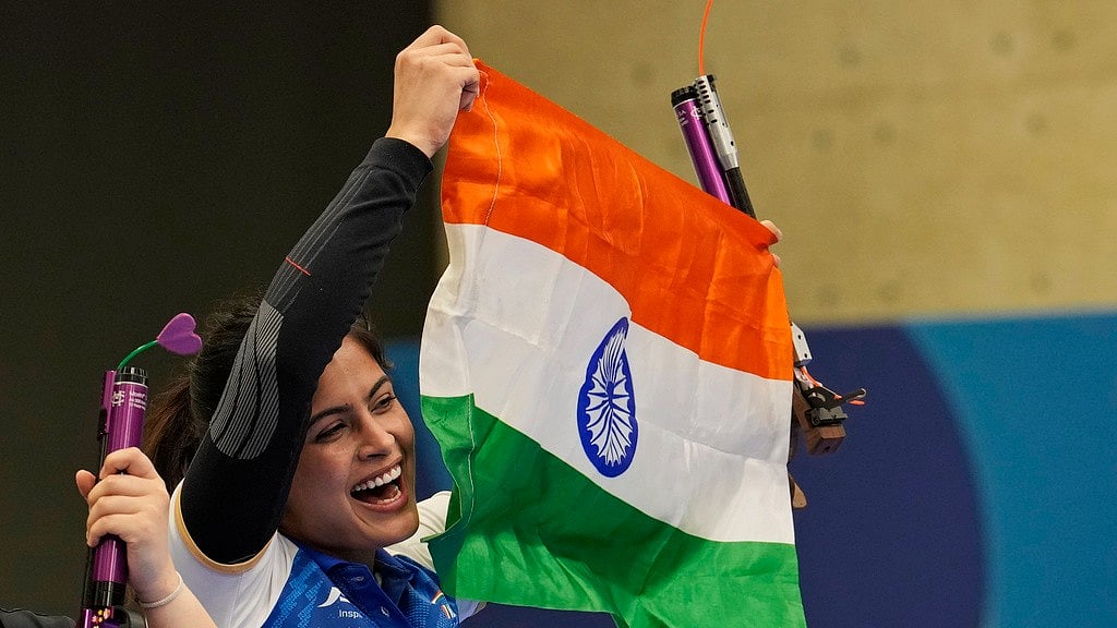 AP/Manish Swarup : Manu Bhaker celebrates with the tri-colour after winning India its first medal at Paris Olympic Games 2024.