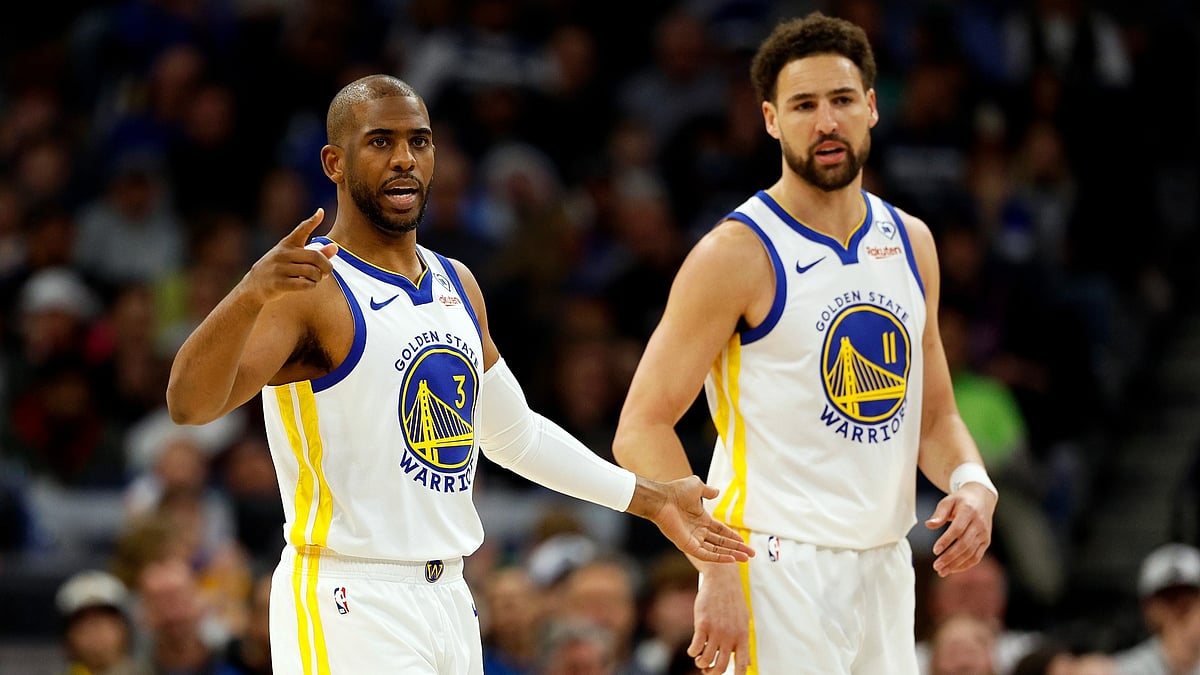 Chris Paul (left) and Klay Thompson of the Golden State Warriors look on during a game on March 24, 2024.