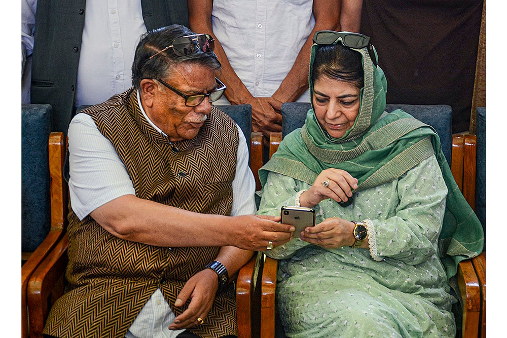 Mehbooba Mufti with political leader Khursheed Alam as he rejoins PDP
