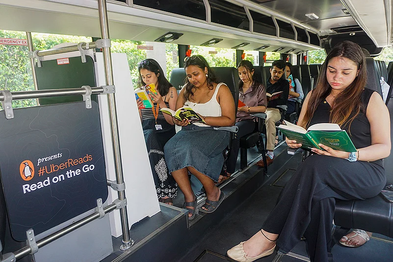 Uber Reads service: Passengers read books inside an Uber shuttle in New Delhi