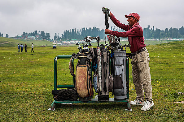Getty Images : An employee of the Golf Course is checking golf equipment at Famous Ski Resort in Gulmarg