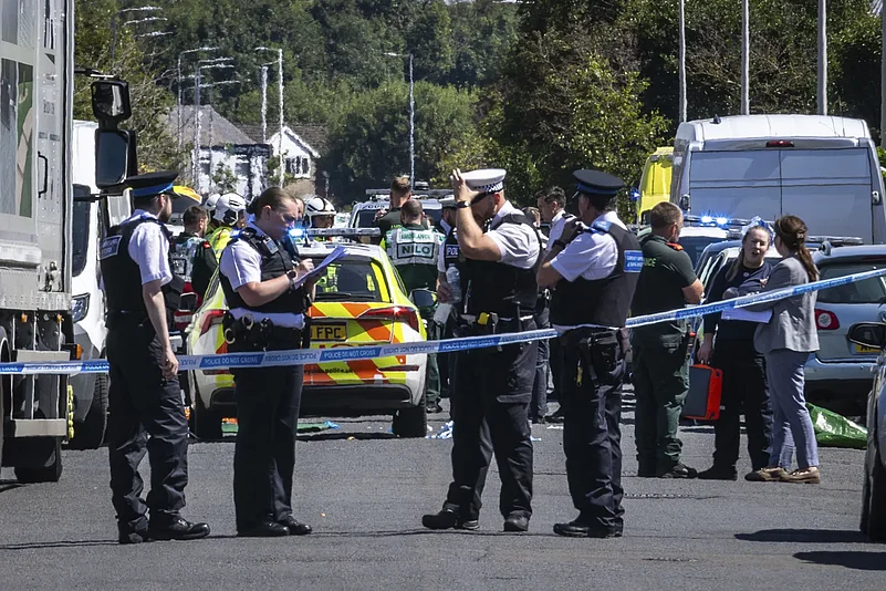 Police personnel secure the area after Southport stabbing |