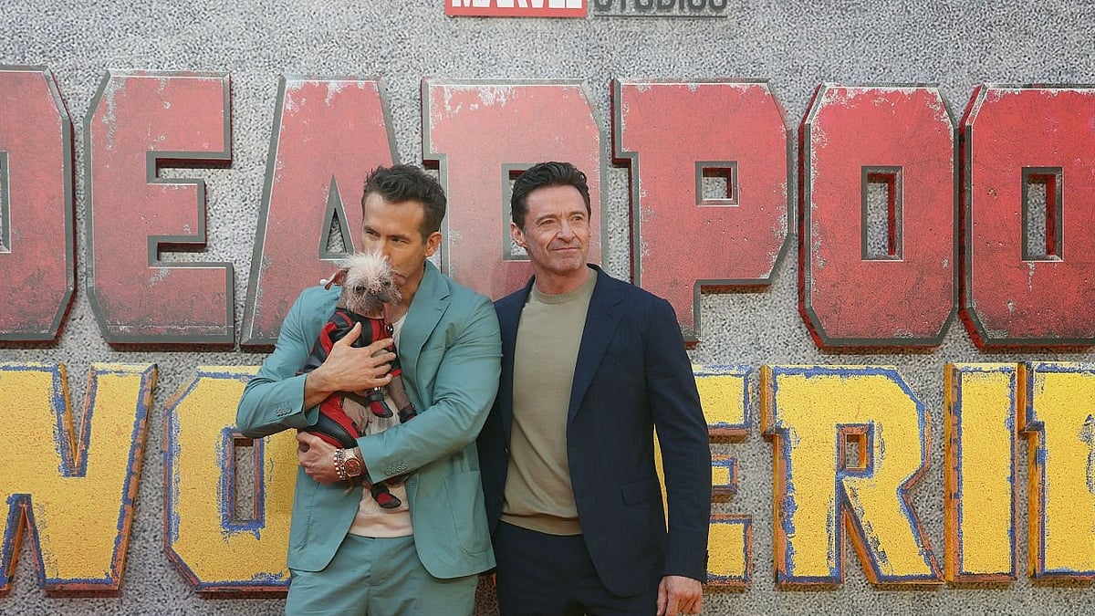 Peggy with Ryan Reynolds (L) and Hugh Jackman.  - Getty images