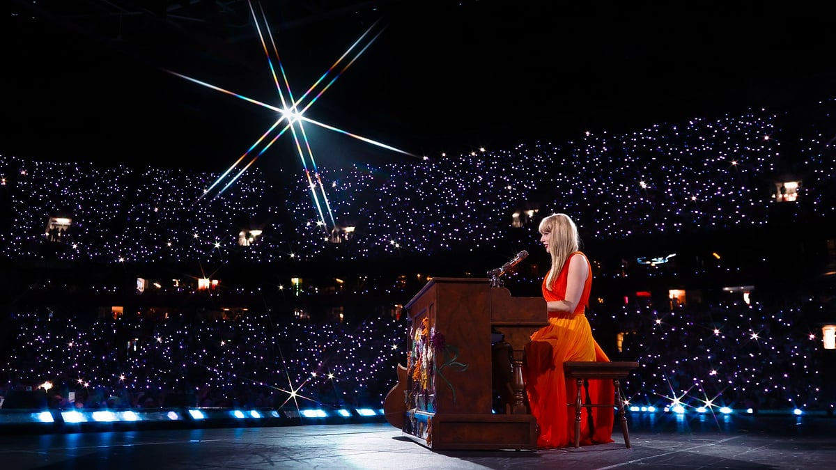 Taylor Swift performing during Eras Tour - X