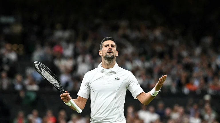 Novak Djokovic silences the Centre Court crowd en route to hammering Holger Rune on Monday. - null