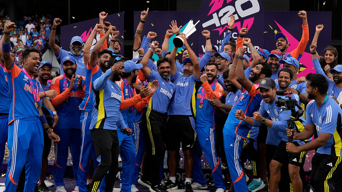 India's head coach Rahul Dravid, centre, and players celebrate with the winners' trophy after defeating South Africa in the ICC Men's T20 World Cup final cricket match at Kensington Oval in Bridgetown, Barbados. - AP Photo/Ricardo Mazalan