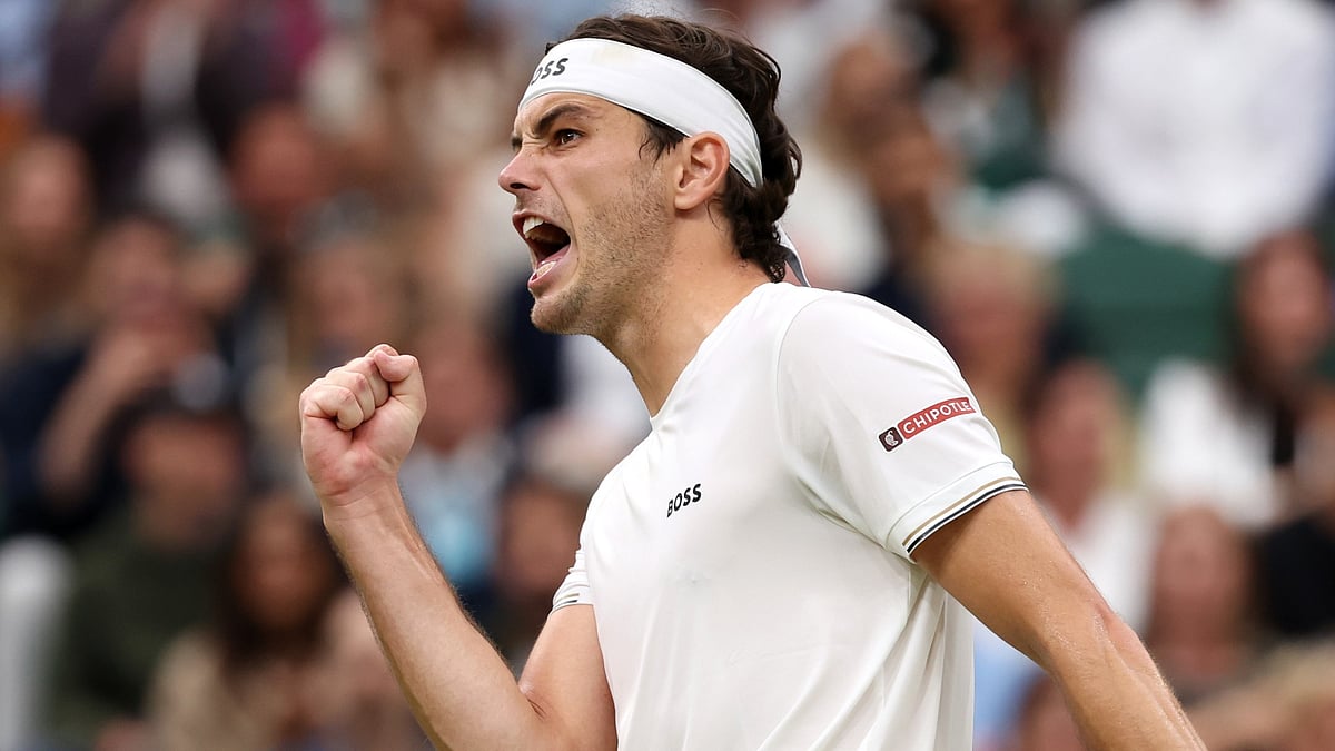 Taylor Fritz roars in celebration at the Centre Court crowd.