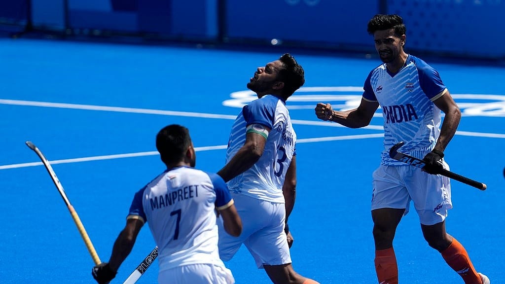 India's Harmanpreet Singh, center, celebrates after scoring a goal during the men's field hockey match between India and Argentina at the Yves-du-Manoir Stadium, at the 2024 Summer Olympics, Monday, July 29, 2024, in Colombes, France. - AP