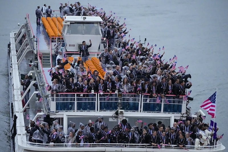 Athletes from the United States travel by boat down the Seine River in Paris, France, during the opening ceremony of the 2024 Summer Olympics, Friday, July 26, 2024.
