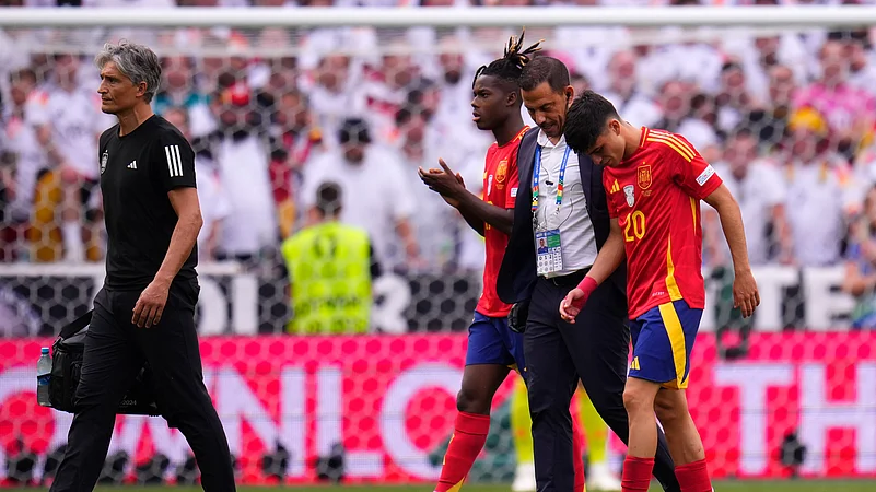 Spains Pedri, right, leaves the pitch after suffering an injury during a quarter-final match between Germany and Spain. AP Photo