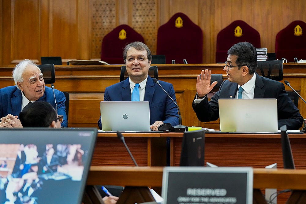 DY Chandrachud, Justice JB Pardiwala and lawyer Kapil Sibal during Special Lok Adalat