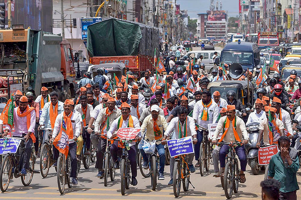 BJP activists take part in a cycle jatha to protest in Chikmagalur