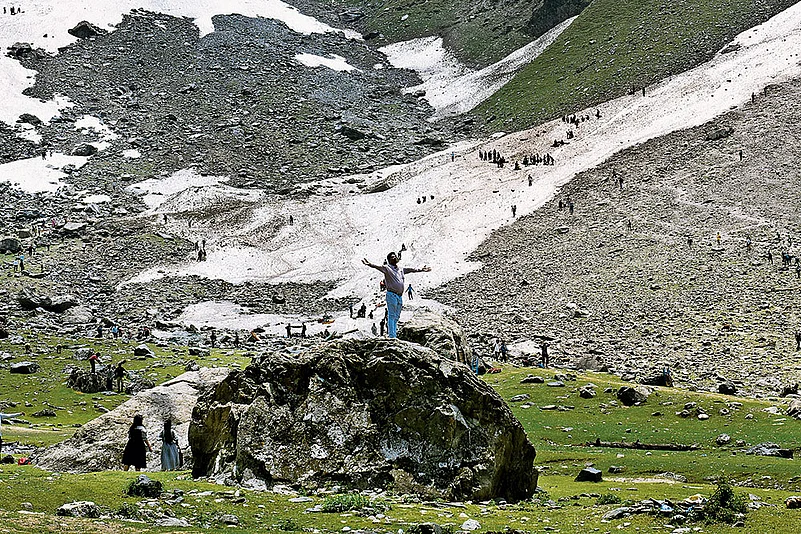 Tourism Takes Over: A tourist getting clicked near the Thajiwas glacier