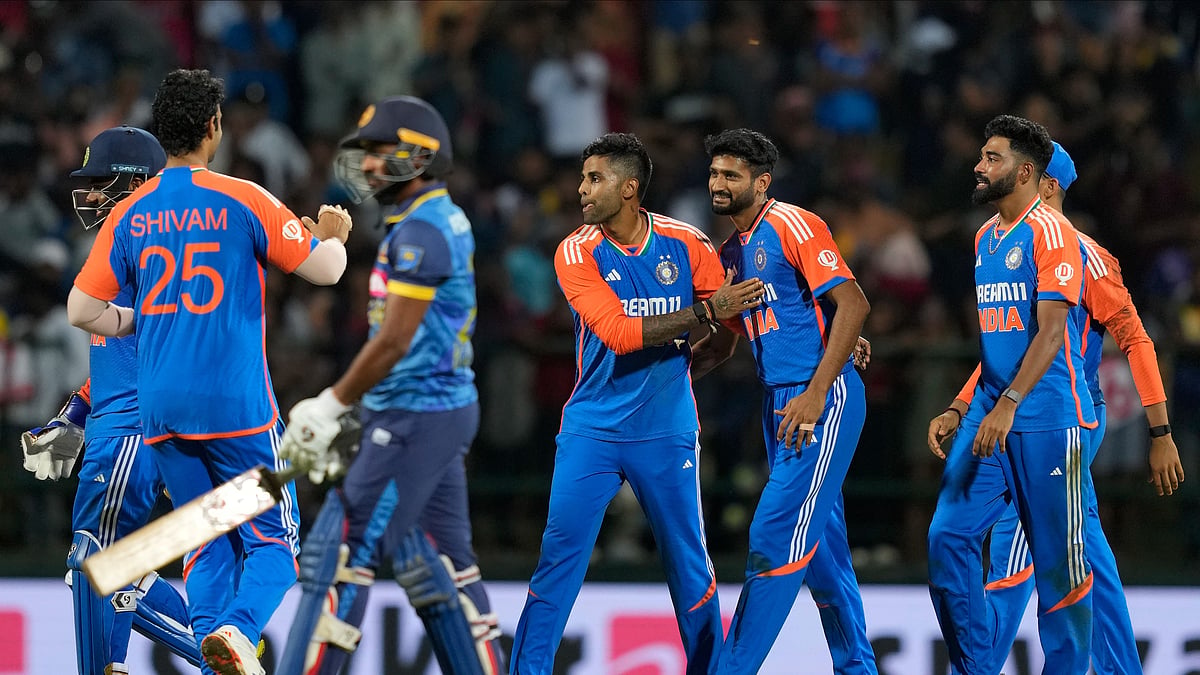 India's captain Suryakumar Yadav celebrates the wicket of Sri Lanka's Kamindu Mendis during the third Twenty20 cricket match between Sri Lanka and India in Pallekele, Sri Lanka. - AP Photo/Eranga Jayawardena