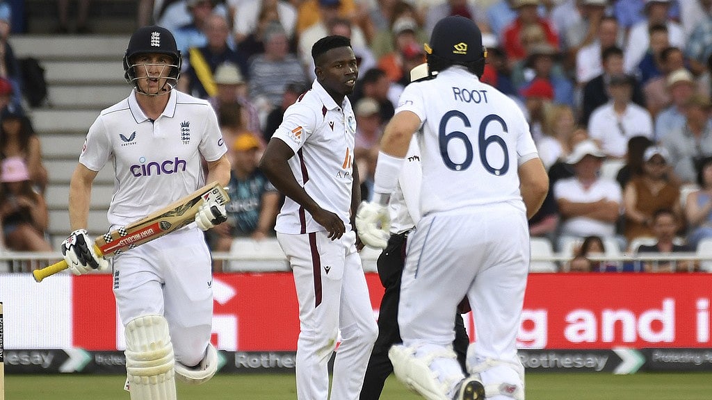 AP : West Indies' Kevin Sinclair, centre, reacts as England's Harry Brook, left, and Joe Root add runs during day three of the second Test at Trent Bridge, Nottingham on Saturday (July 20, 2024).
