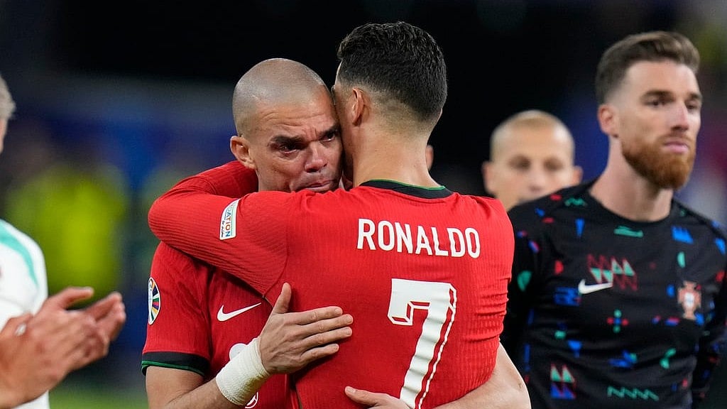 Portugal's Cristiano Ronaldo, right, embraces Pepe at the end of a quarter final match against France at the Euro 2024 soccer tournament in Hamburg, Germany, Friday, July 5, 2024.

 - AP/Hassan Ammar