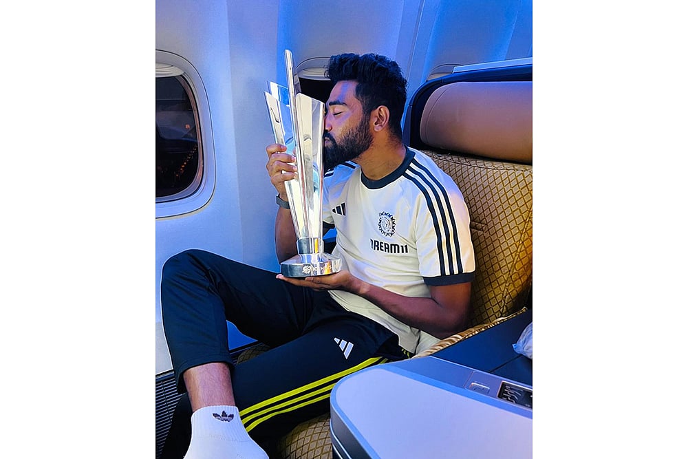 Mohammed Siraj with T20 cricket World Cup 2024 trophy