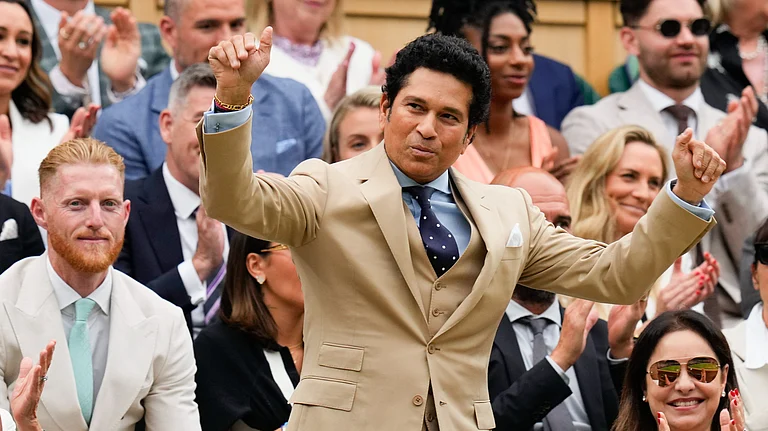 Former Indian cricketer Sachin Tendulkar reacts as he is introduced on Centre Court ahead of the third-round match between Cameron Norrie of Britain and Alexander Zverev of Germany at the Wimbledon tennis championships in London. - AP Photo/Kirsty Wigglesworth