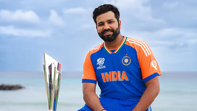 X/BCCI : Rohit Sharma poses with the ICC T20 World Cup 2024 trophy in Barbados.