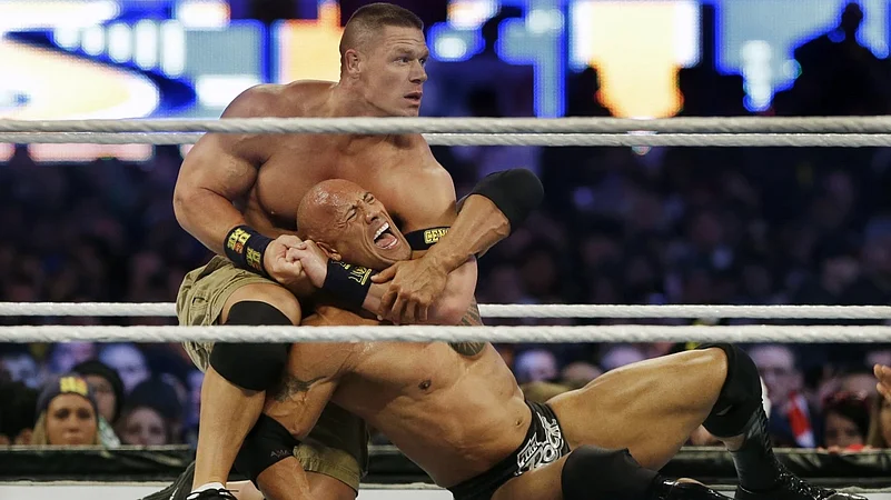 WWE, John Cena, The Rock, AP Photo
