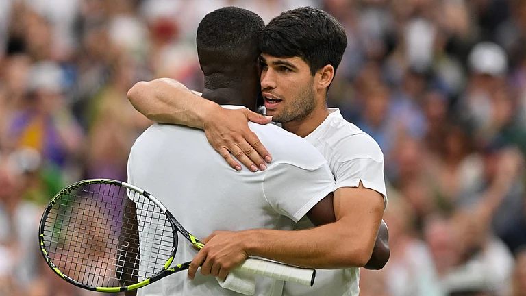 Carlos Alcaraz and Frances Tiafoe after their Wimbledon classic. - null