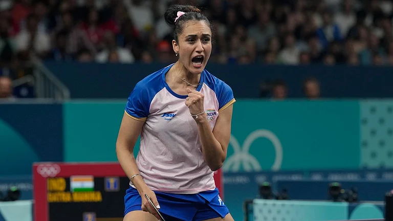 India's Manika Batra reacts after a winning point against France's Prithika Pavade during a women's singles round of 32 table tennis game. - AP