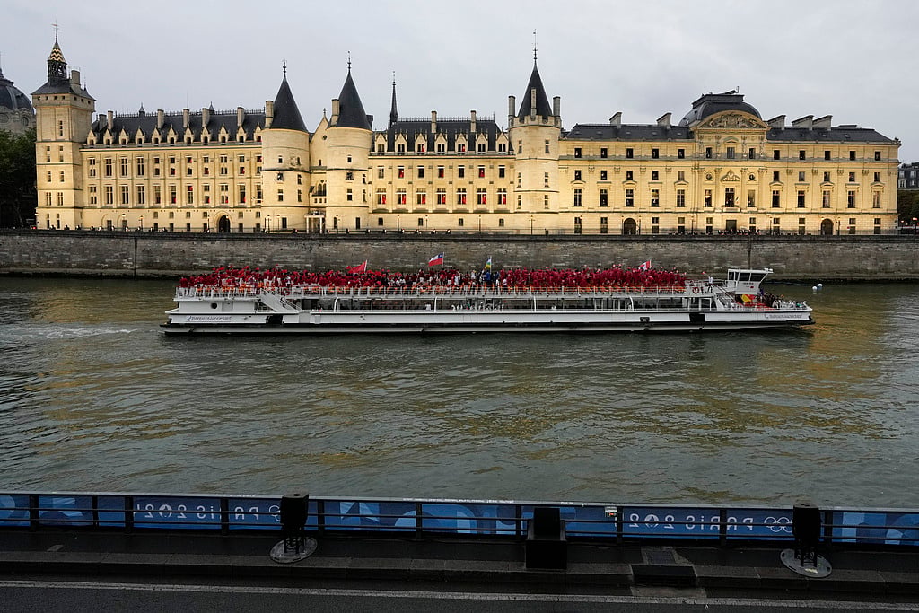 Athletes from Canada travel by boat down the Seine River in Paris, France, during the opening ceremony of the 2024 Summer Olympics, Friday, July 26, 2024.