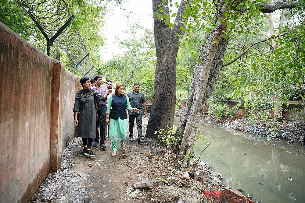 Atishi inspects overflowed drains in Delhi