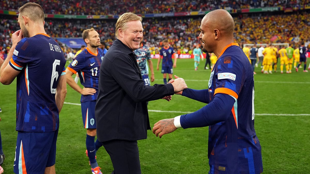 Koeman celebrates with Donyell Malen