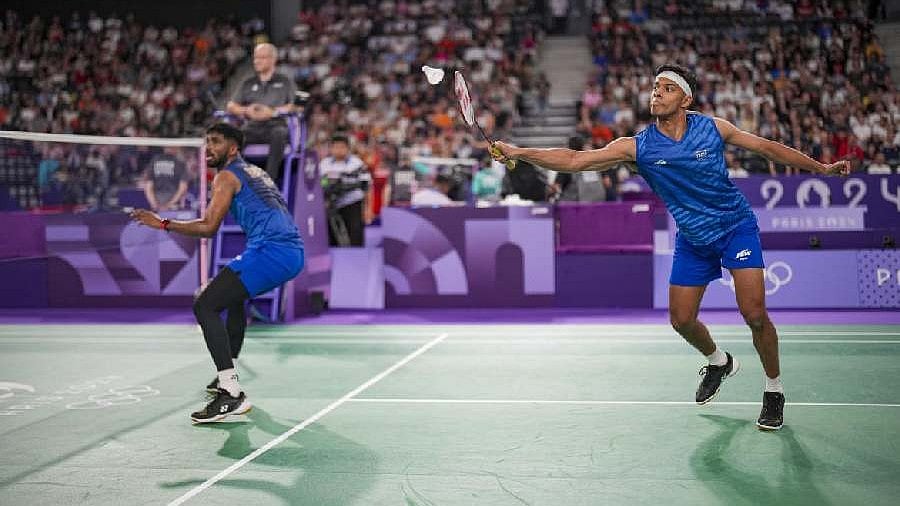 AP/PTI : India's Satwiksairaj Rankireddy and Chirag Shetty play against France's Lucas Corvee and Ronan Labar during the 2024 Summer Olympics, Saturday, July 27, 2024, in Paris, France