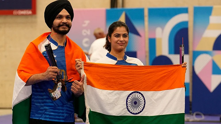 India's Manu Bhaker, right, and Sarabjot Singh celebrate after winning the bronze medal in the 10m air pistol mixed team event at the 2024 Summer Olympics. - AP/Manish Swarup